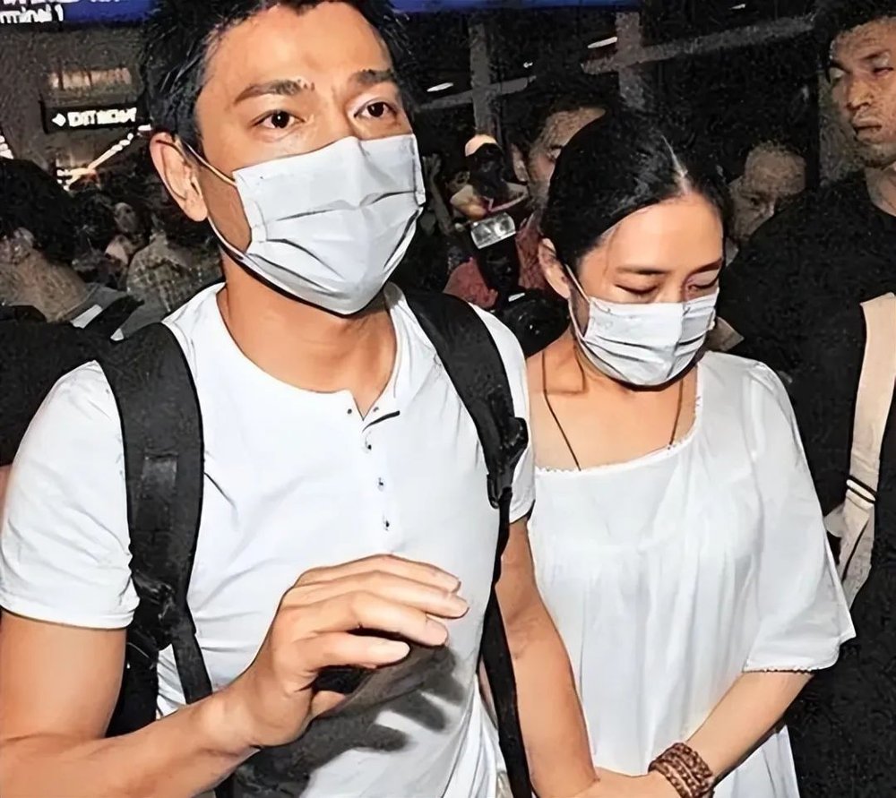 Andy Lau and Carol Chu at a funeral