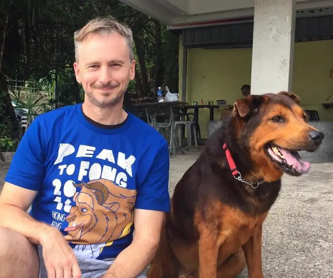 Gregory Charles Rivers with stray dogs